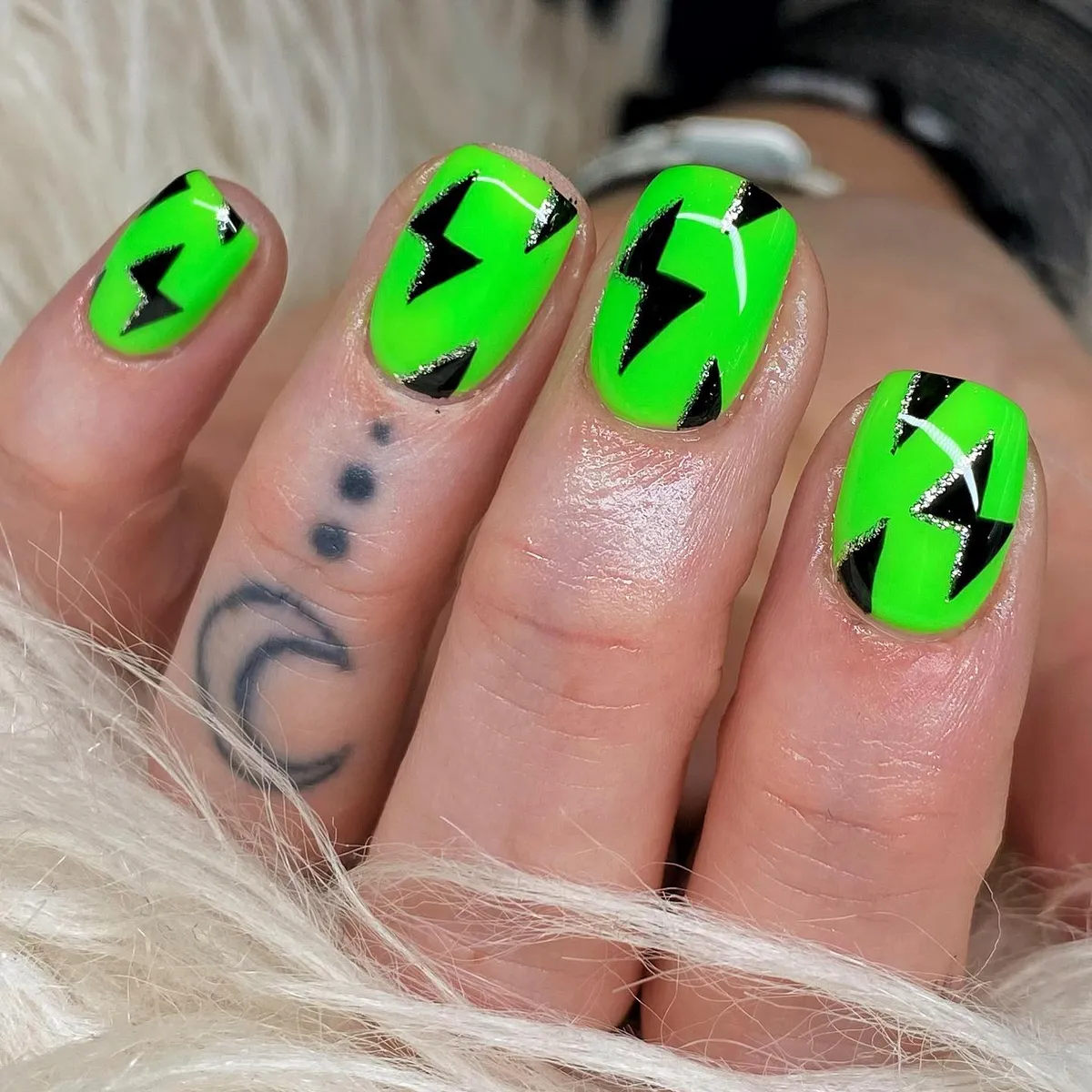 Neon green lightning-bolt nails