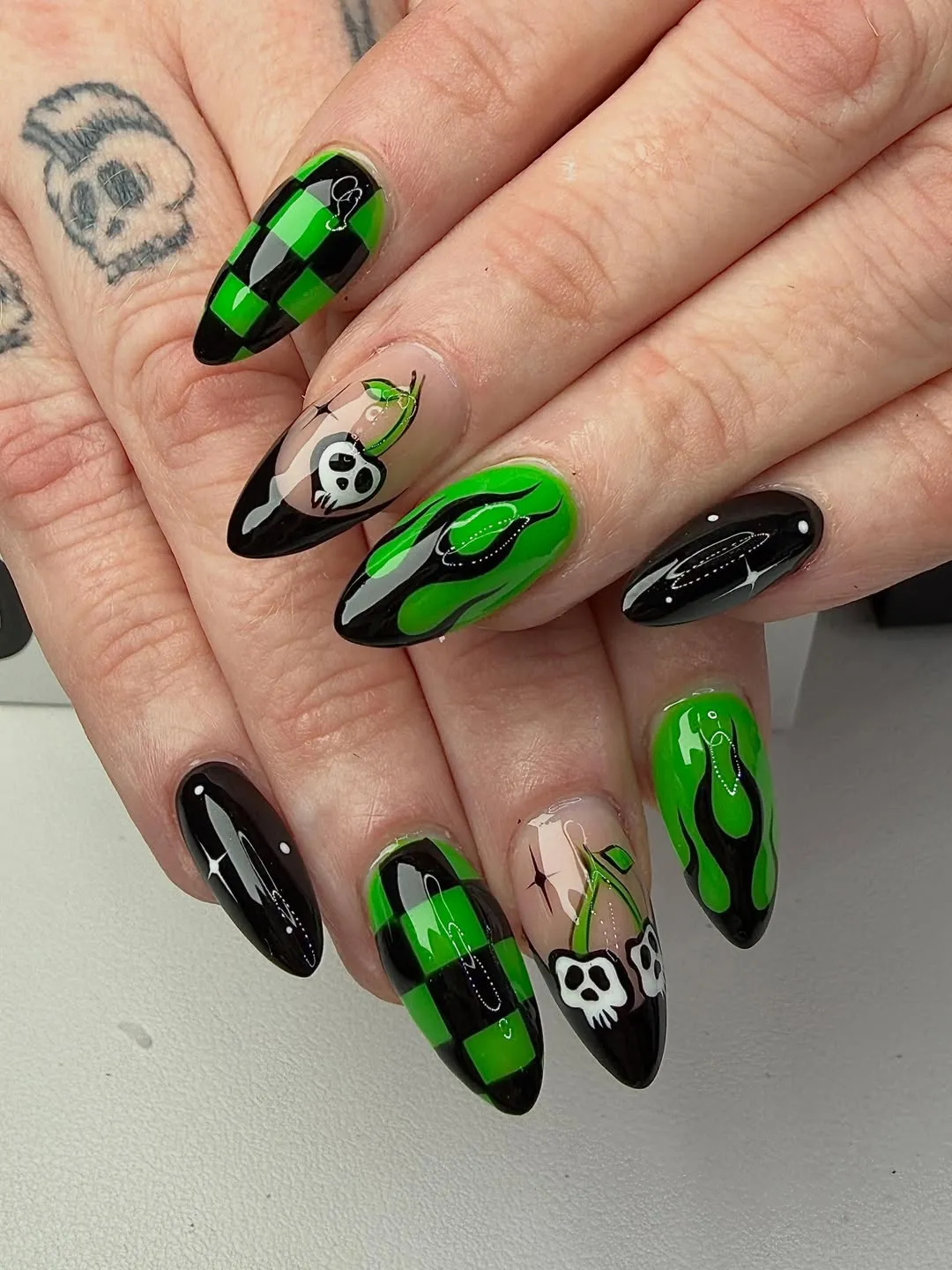 Black and green checkerboard with flames and skull accents
