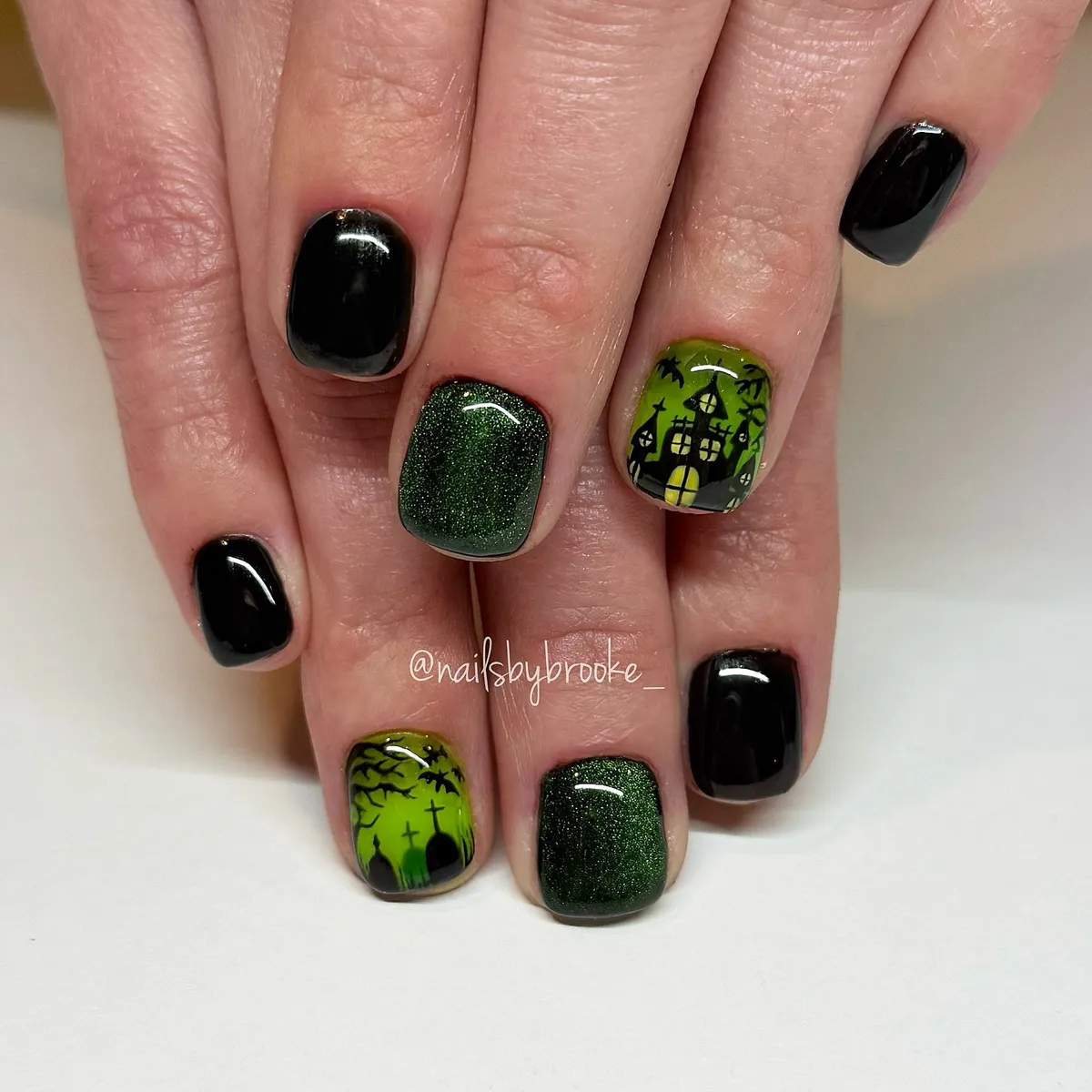 Short black and green shimmer set with silhouette scene accents