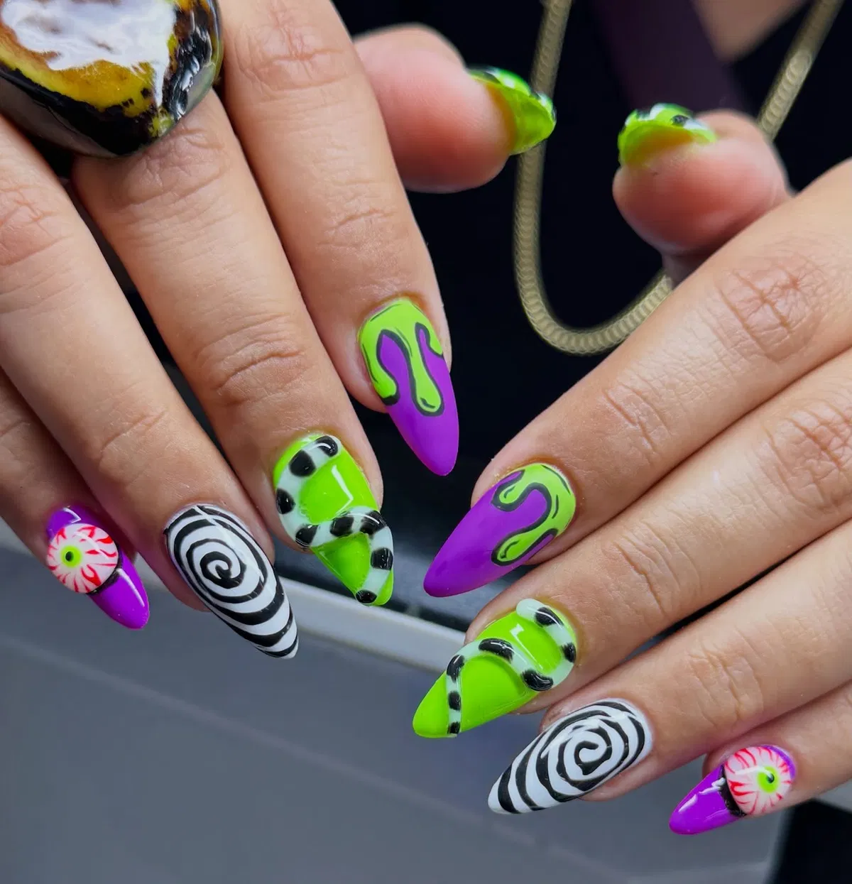 Neon green and purple mix with spirals and eyeballs