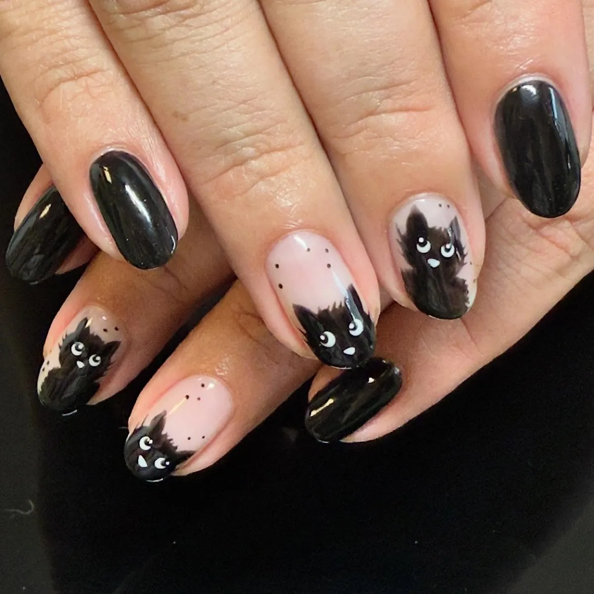 Black cat tips on pale pink with solid black accents