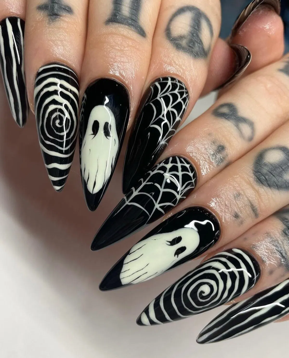 Glossy black stiletto set with ghosts, spirals, stripes, and webs