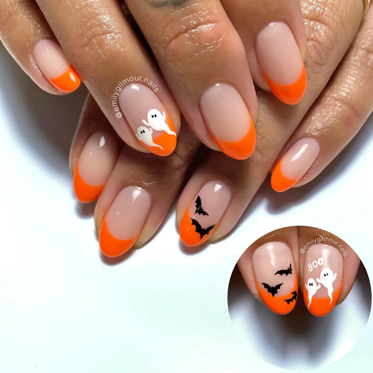 Orange French tips with tiny ghosts and black bats