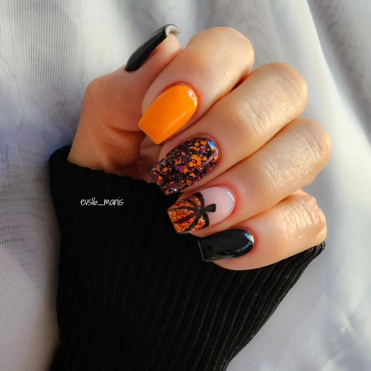 Orange-and-black mix with confetti flecks and a pumpkin accent
