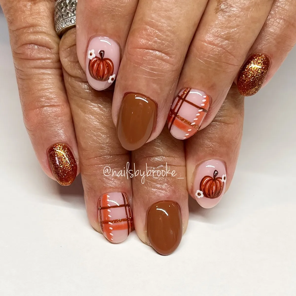 Pumpkin and plaid accents with brown and copper glitter nails