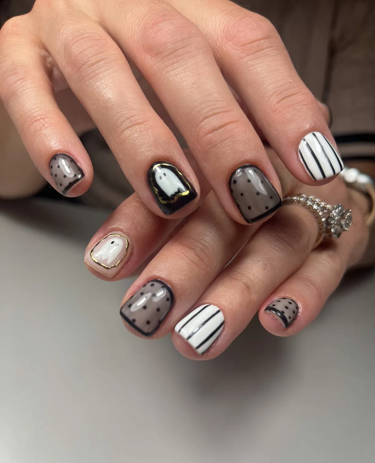 Monochrome ghosts, polka dots, and stripes with gold edging