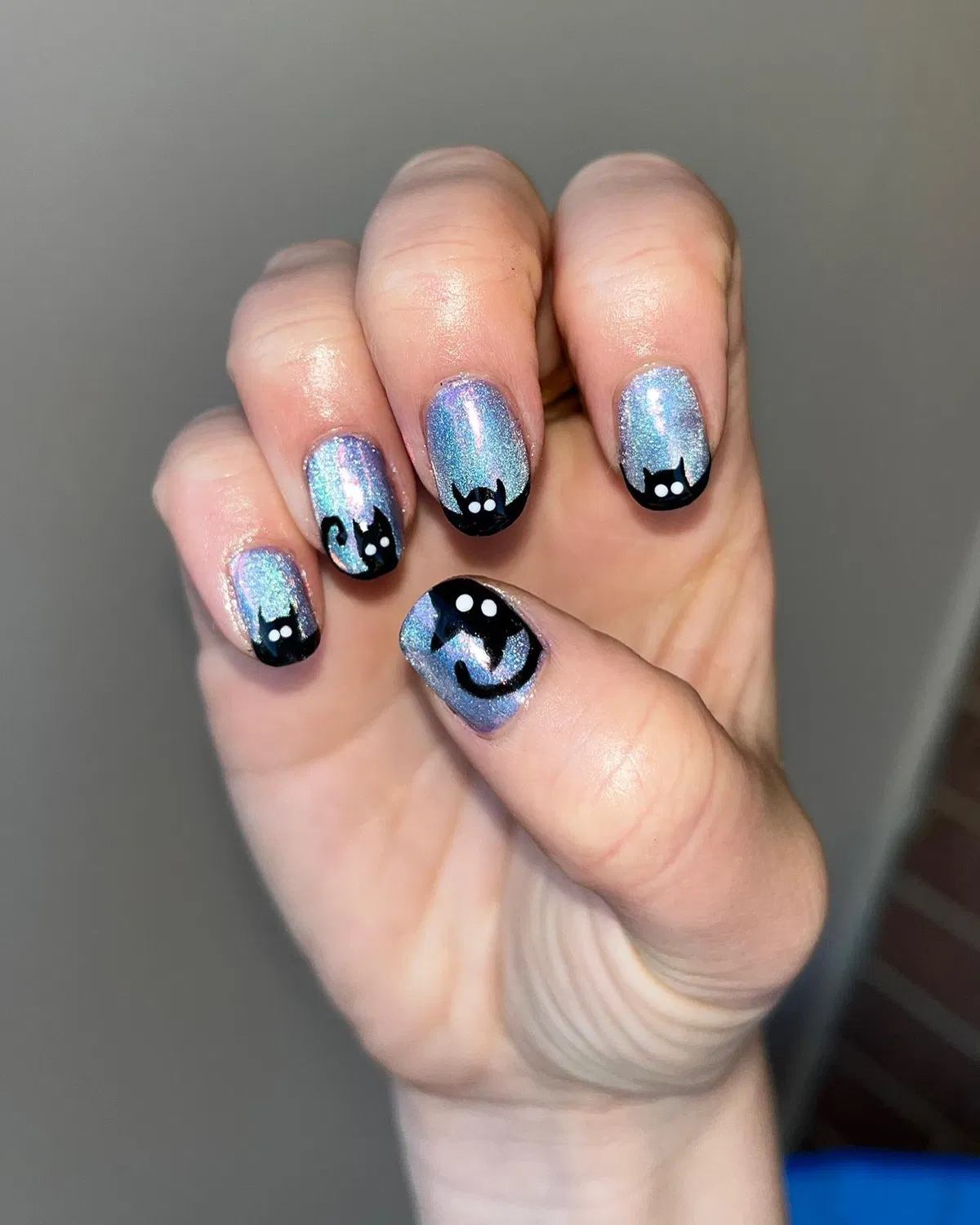Iridescent cat silhouettes
