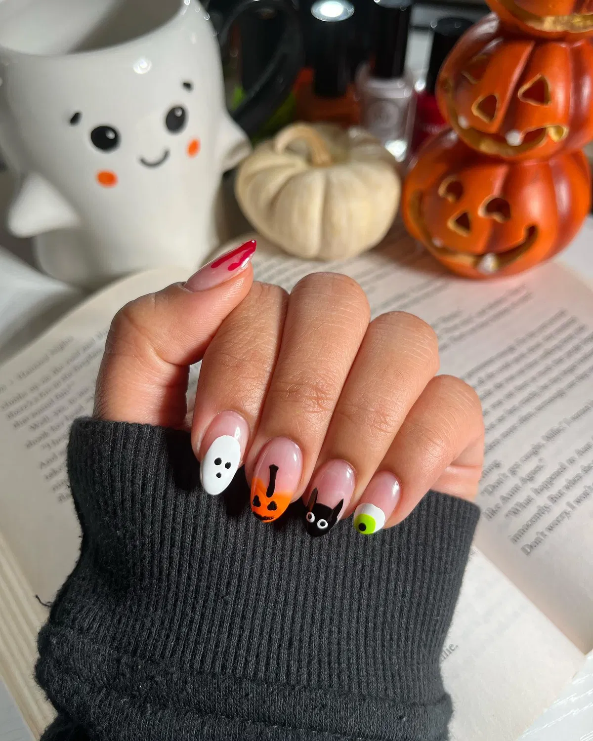 White nails with jagged black tips and eyes