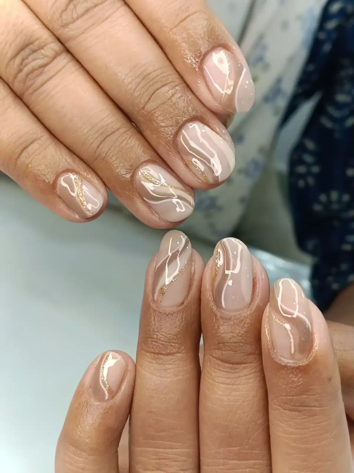 Short Nude Nails with White and Gold Wavy Line Art