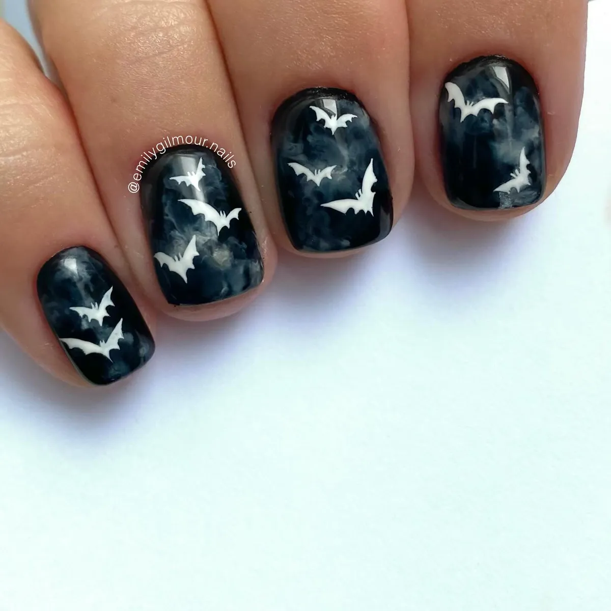 Smoky black nails with white bat silhouettes