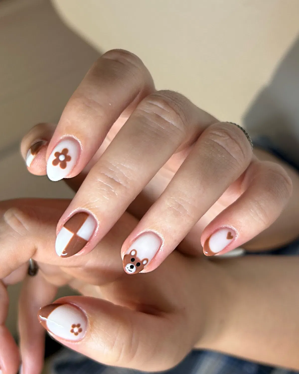 White and brown cute graphics: flower, heart, checker blocks, and bear face