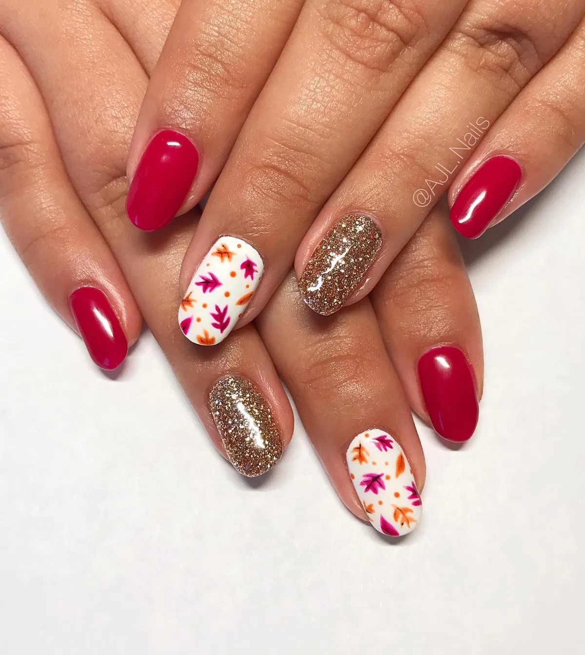 Deep pink with gold glitter and leaf-print accents