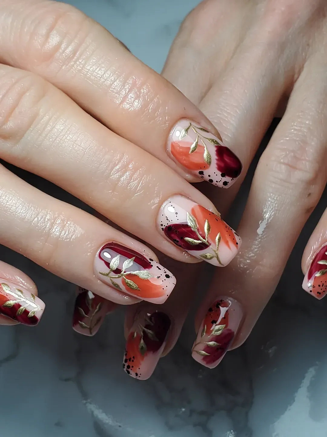 Abstract orange and burgundy with gold leaf branches
