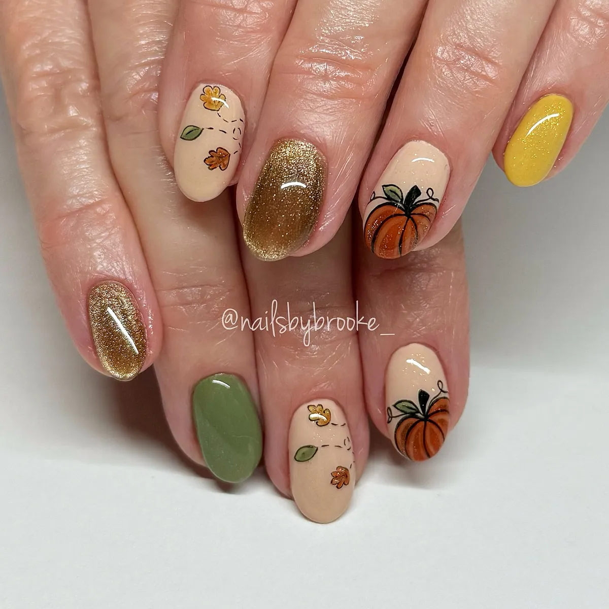 Beige pumpkins with gold glitter accents