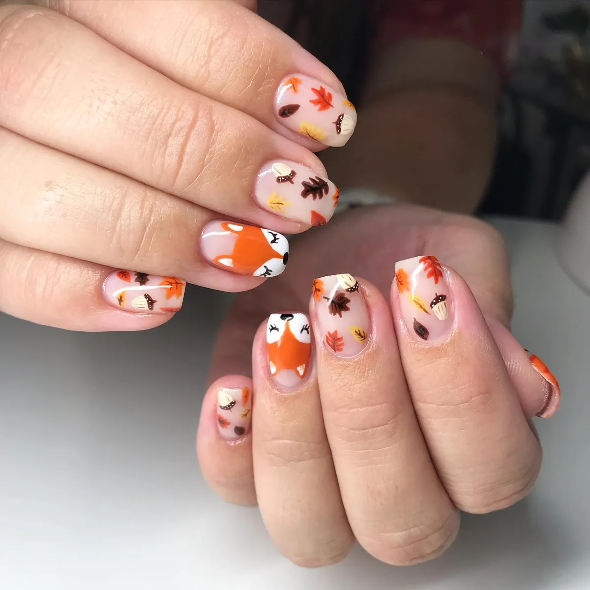 Nude base with leaves, mushrooms, and fox faces
