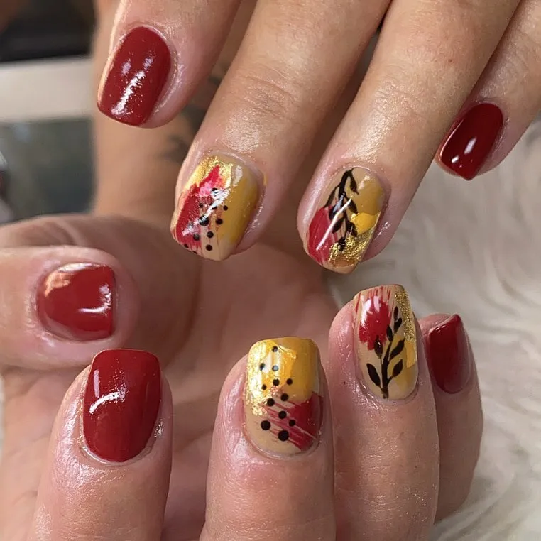 Deep red with mustard-and-red abstract leaf accents