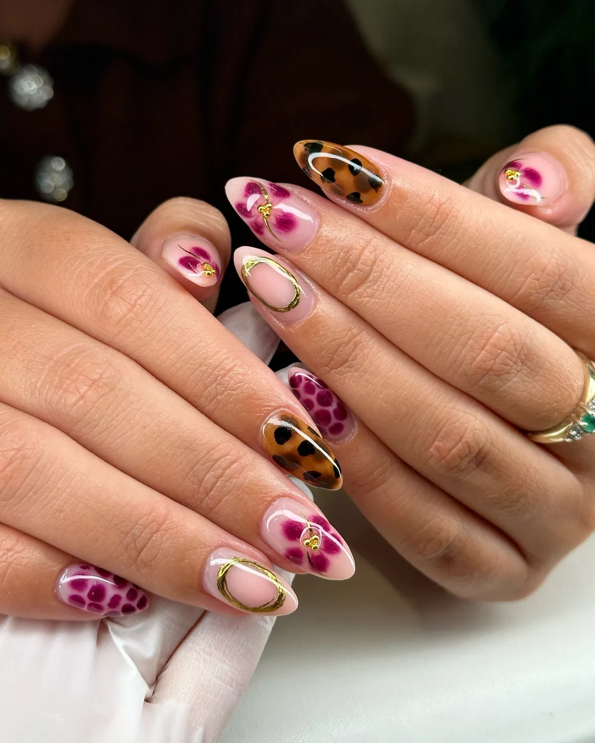 Tortoiseshell accents with magenta florals and gold details