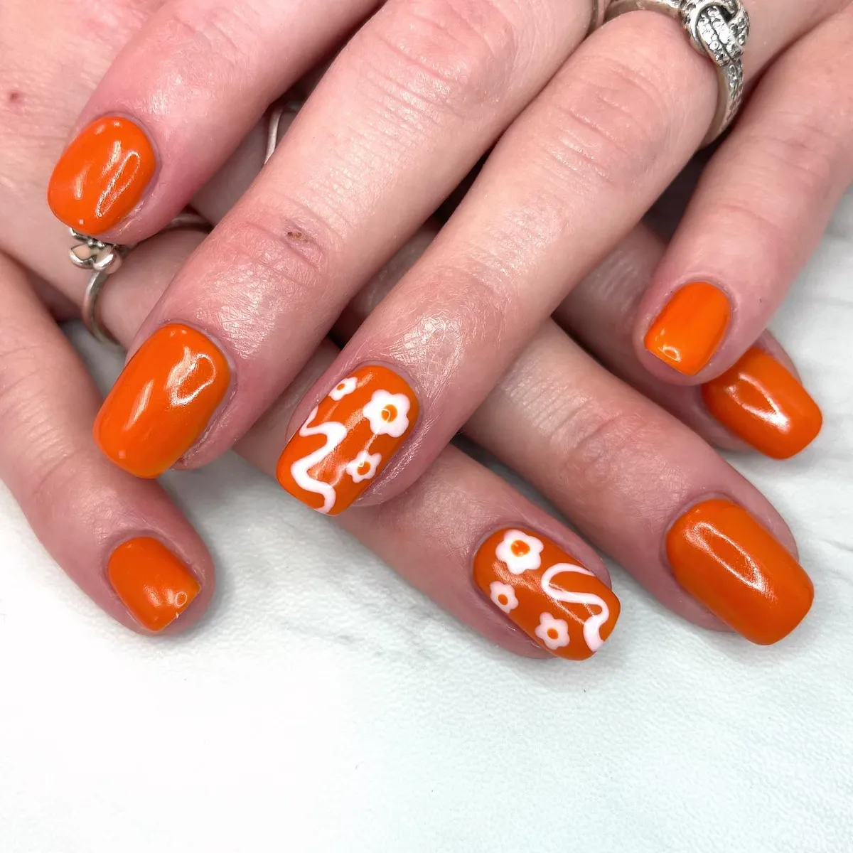 Bright Orange with White Wavy Lines and Simple Flowers