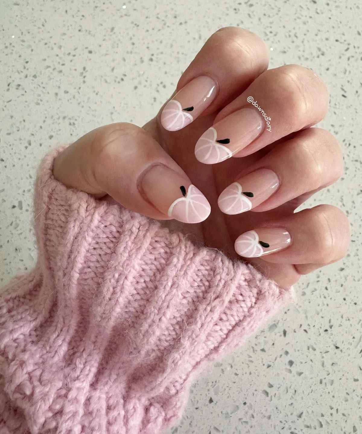 Minimal nude nails with pale pink pumpkin outlines