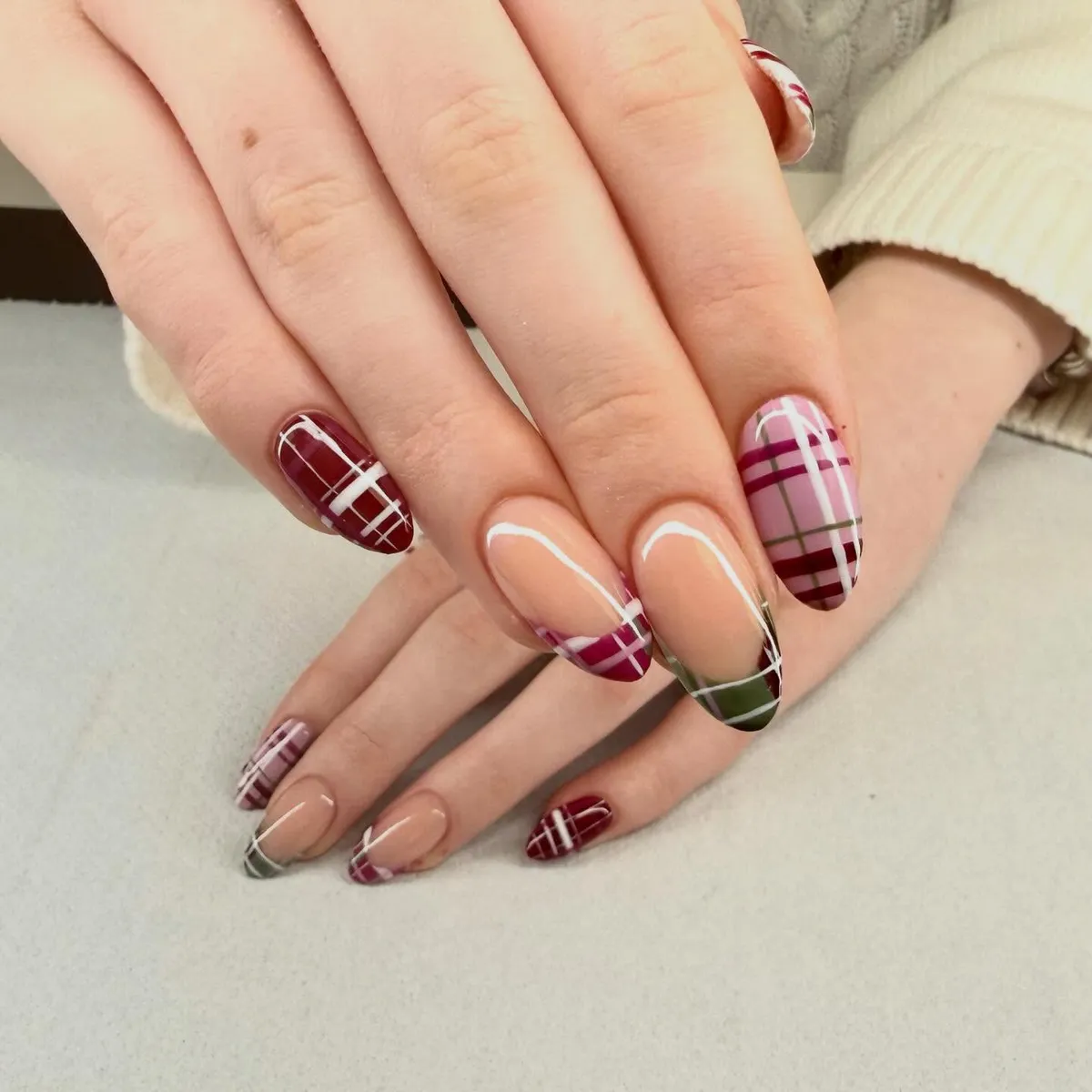 Mixed burgundy and pink plaid with nude-base French tips