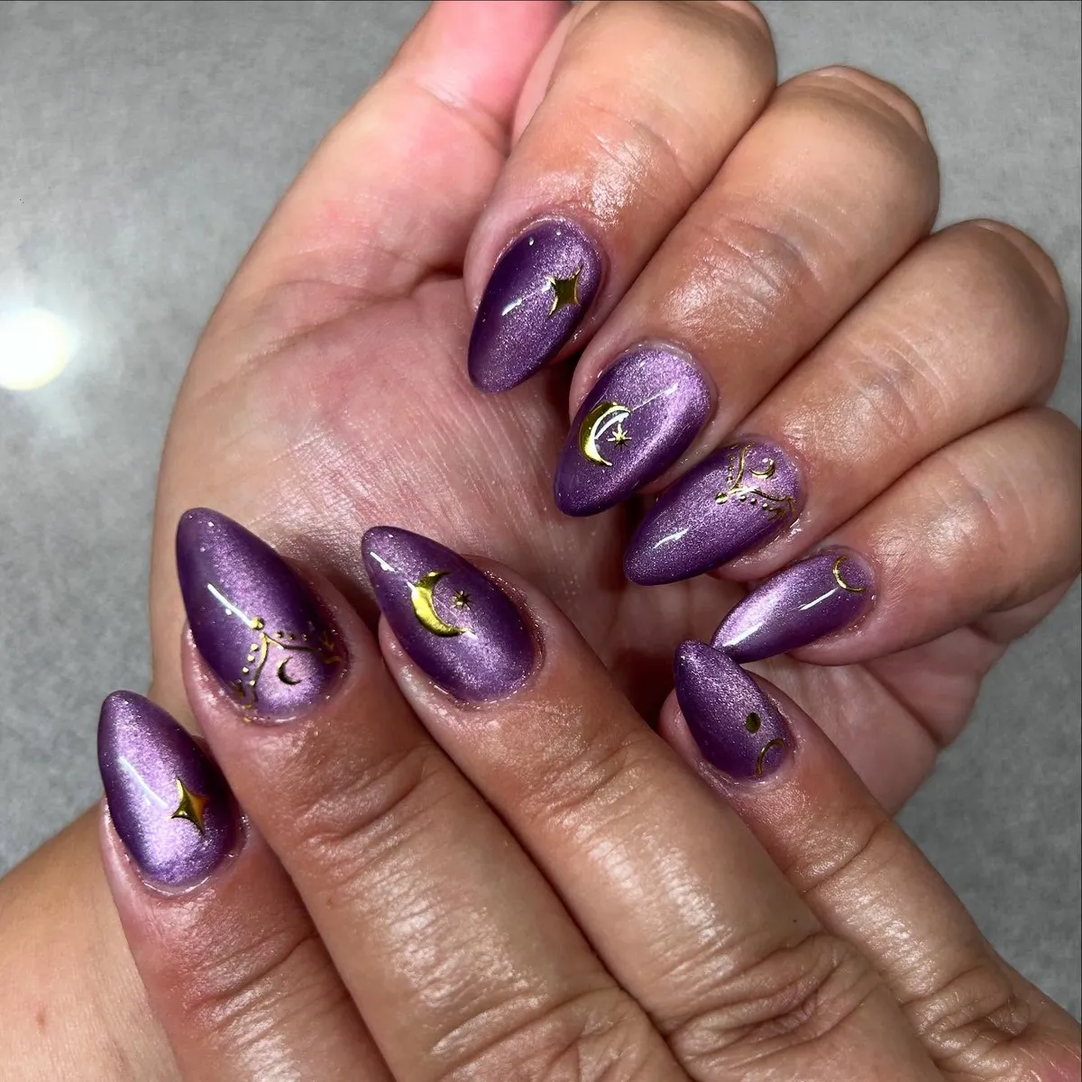 Shimmery purple with gold moon-and-star decals