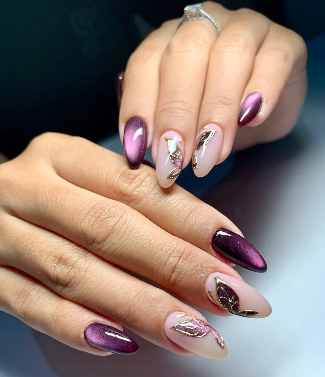 Plum shimmer paired with nude-and-gold leaf motifs