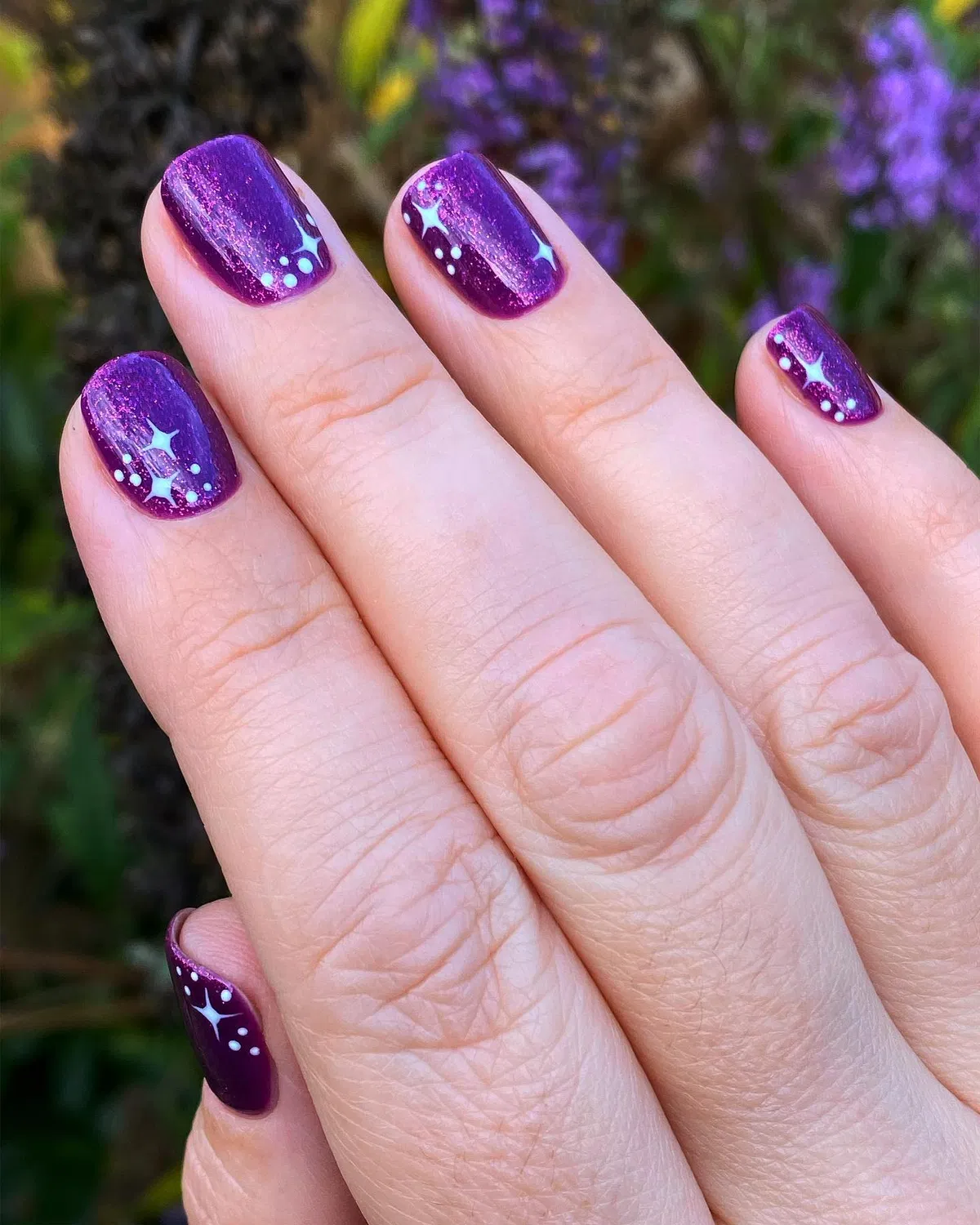 Sparkly plum gradient with white star and dot clusters