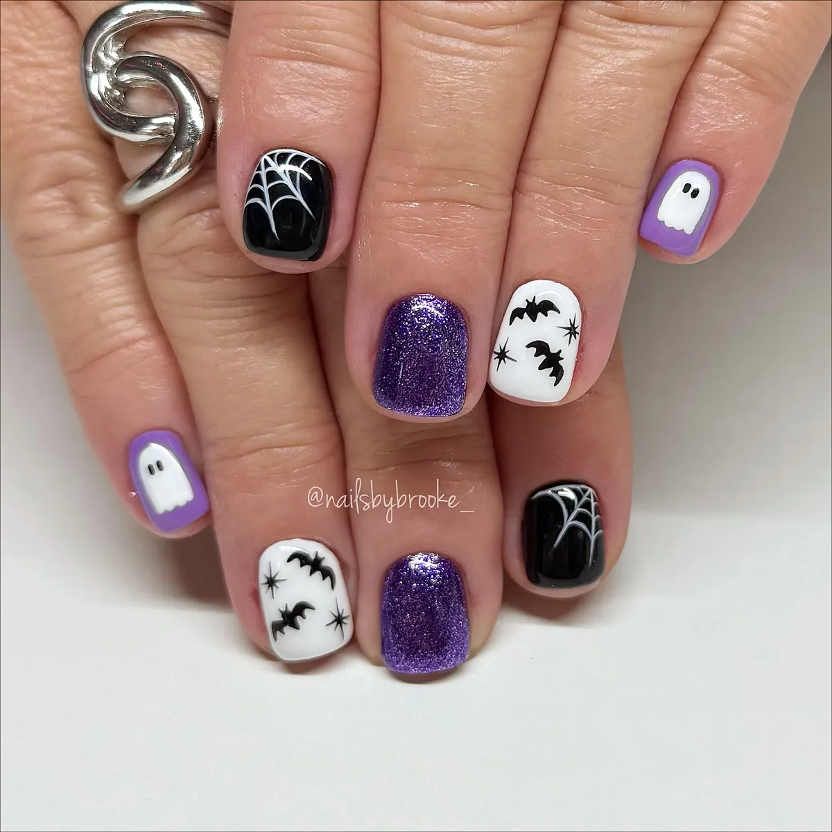 Purple glitter mixed with black-and-white graphic motifs