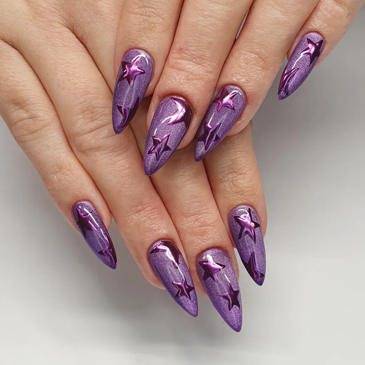 Shimmery purple stilettos with raised star details