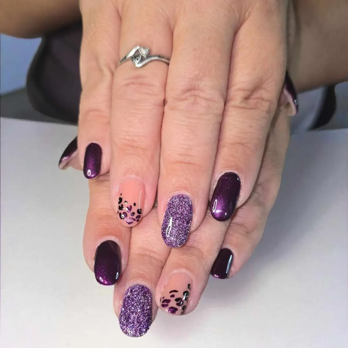 Deep plum with purple glitter and spotted nude accents