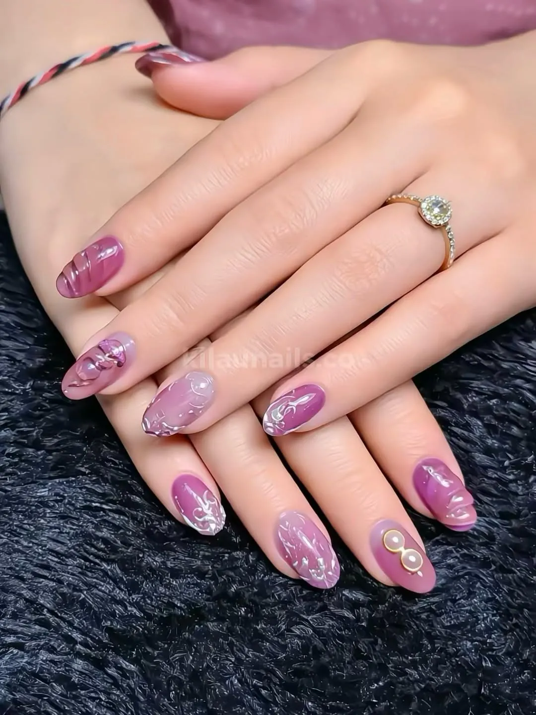 Glossy mauve-plum with raised swirl detailing