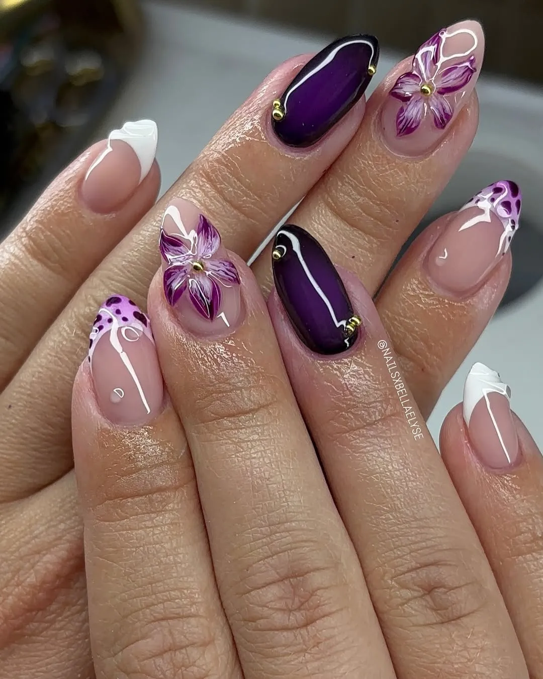 Deep plum accents with white linework and purple florals