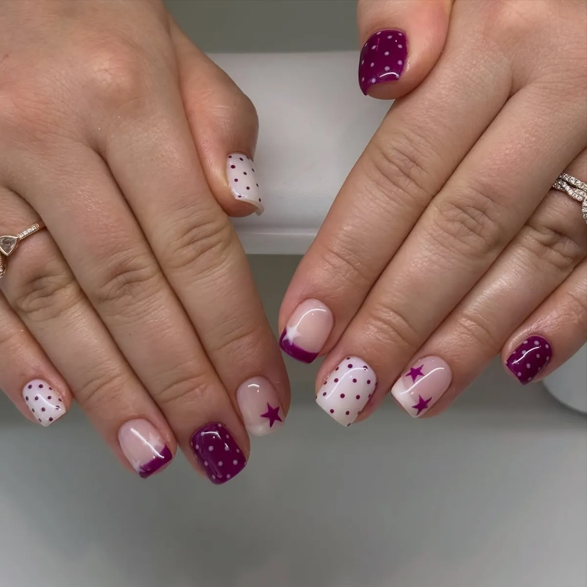 Plum French tips with stars and polka dots