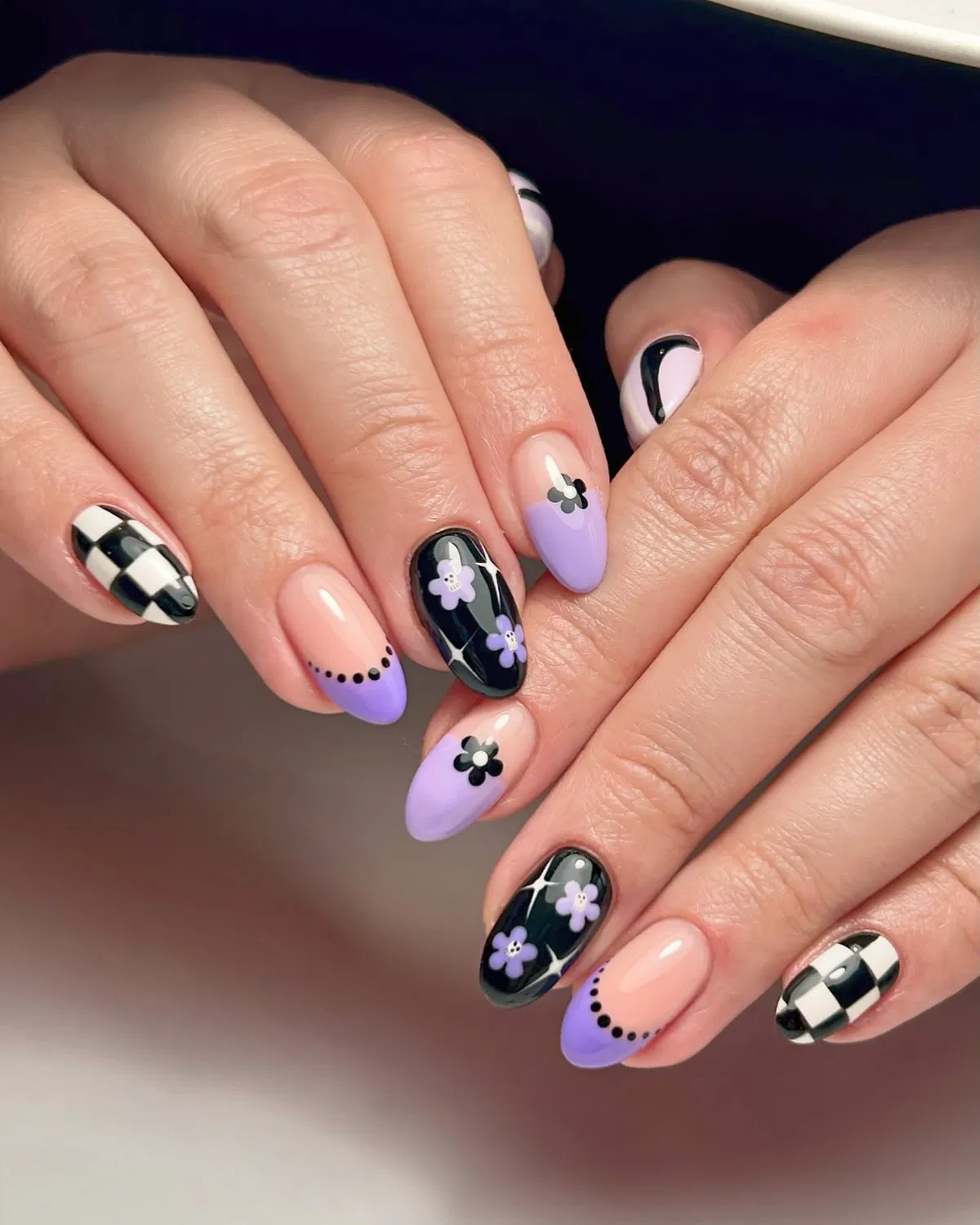 Lavender French tips with checkerboard and floral accents
