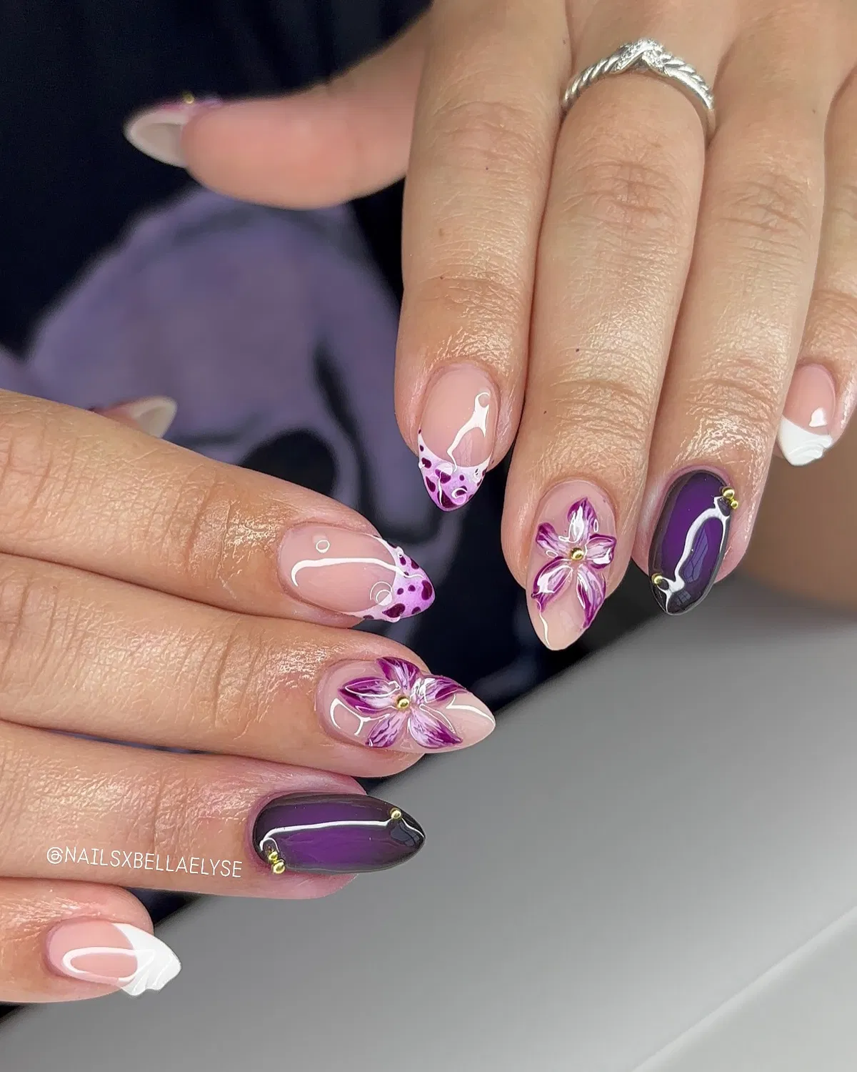 Mixed plum accents: dotted tips, florals, and studded deep purple