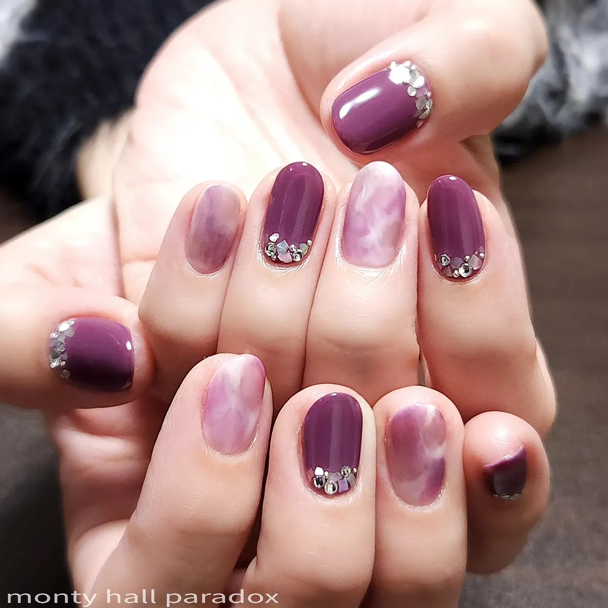 Muted plum with cloudy lavender accents and cuticle crystals