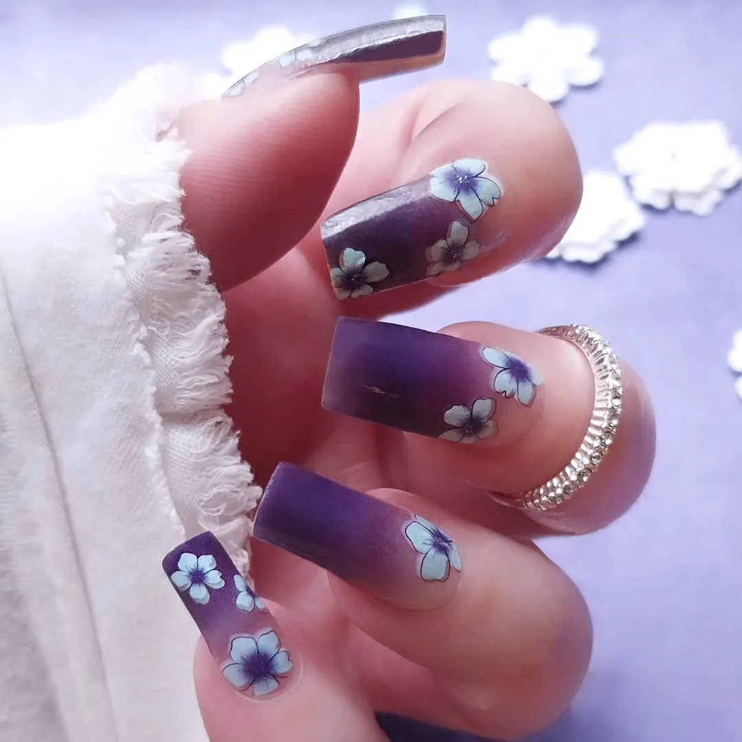 Matte purple ombré with white floral designs