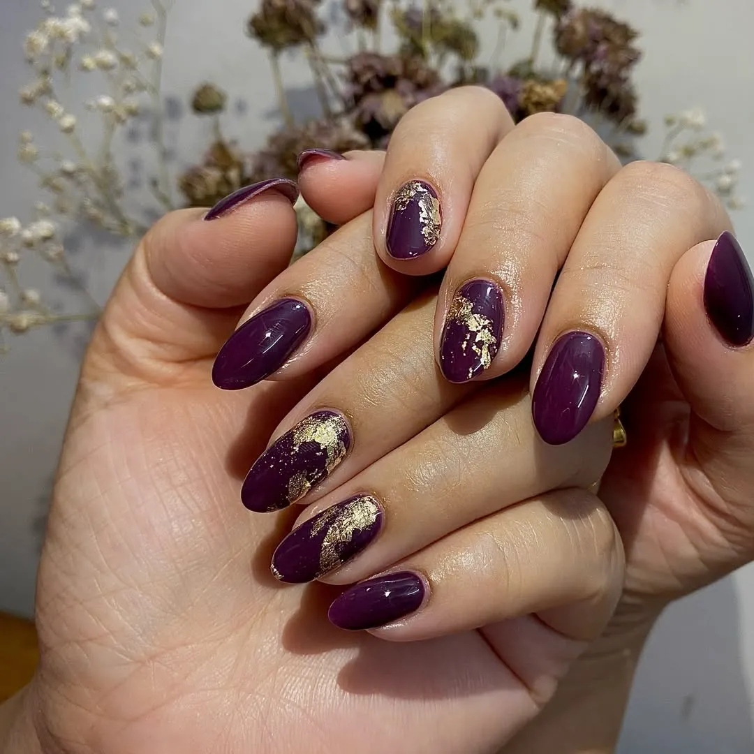 Glossy plum almonds with gold foil accents