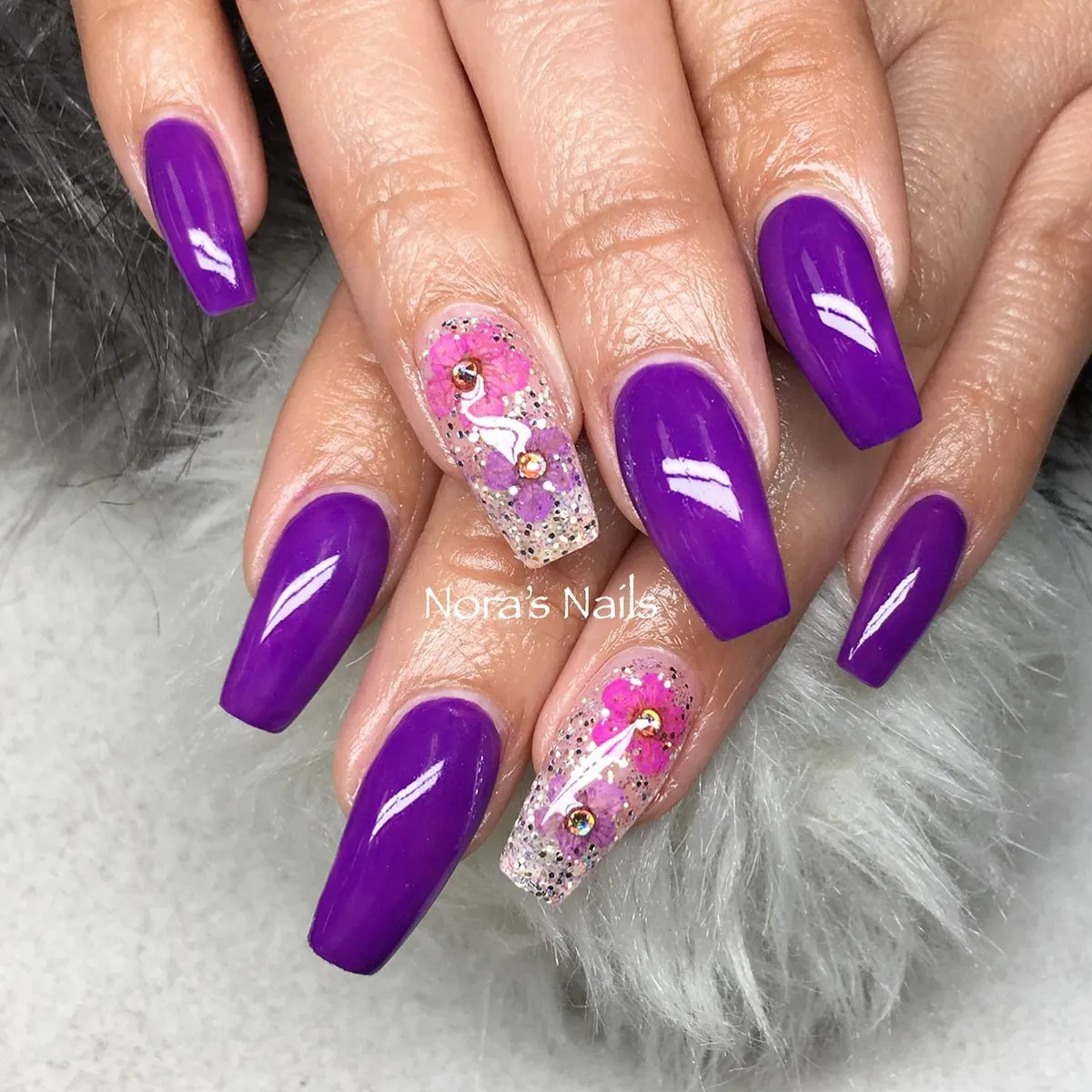 Long bright-purple set with glitter floral accent nails