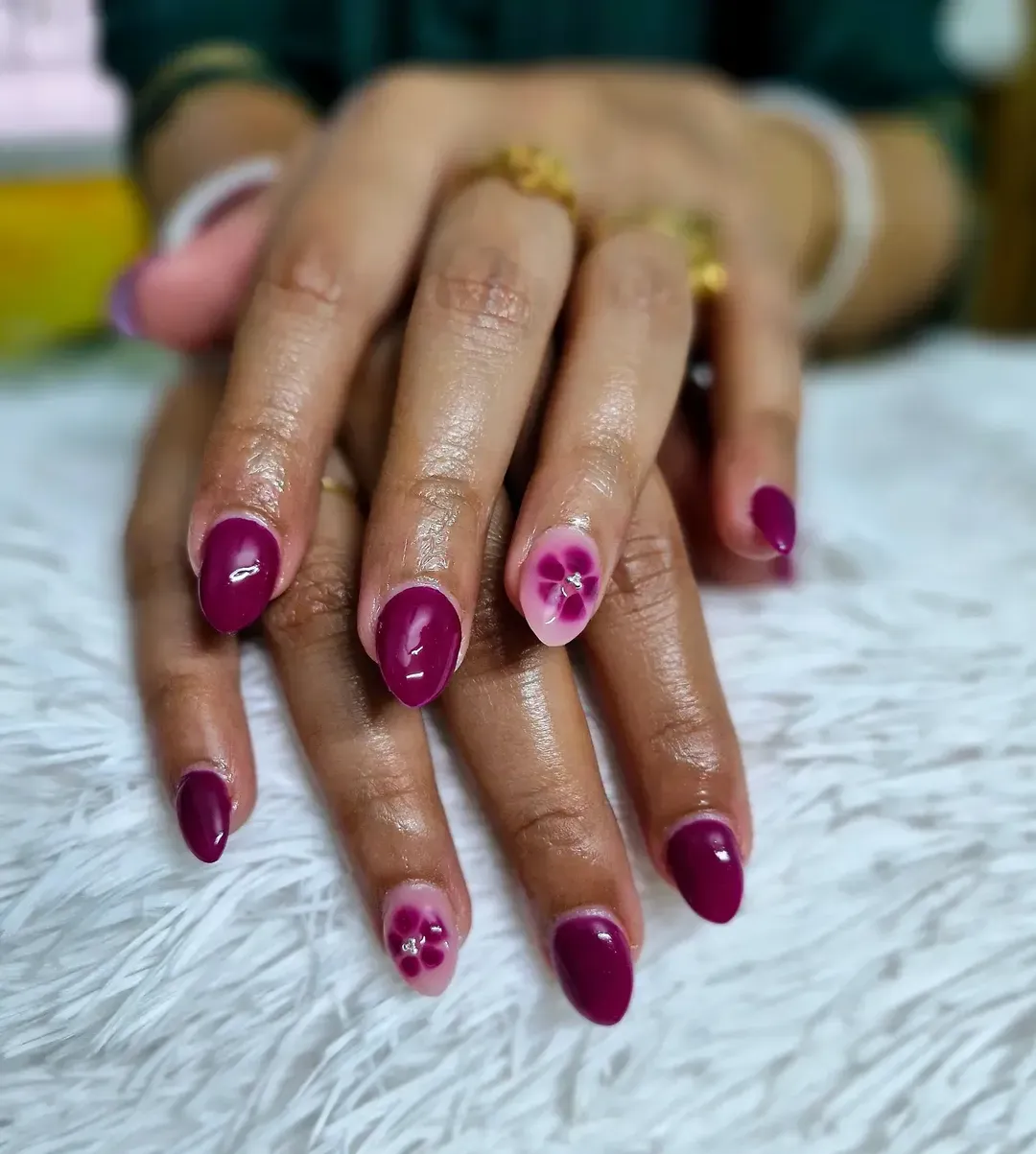 Solid plum with pale pink floral accent nails