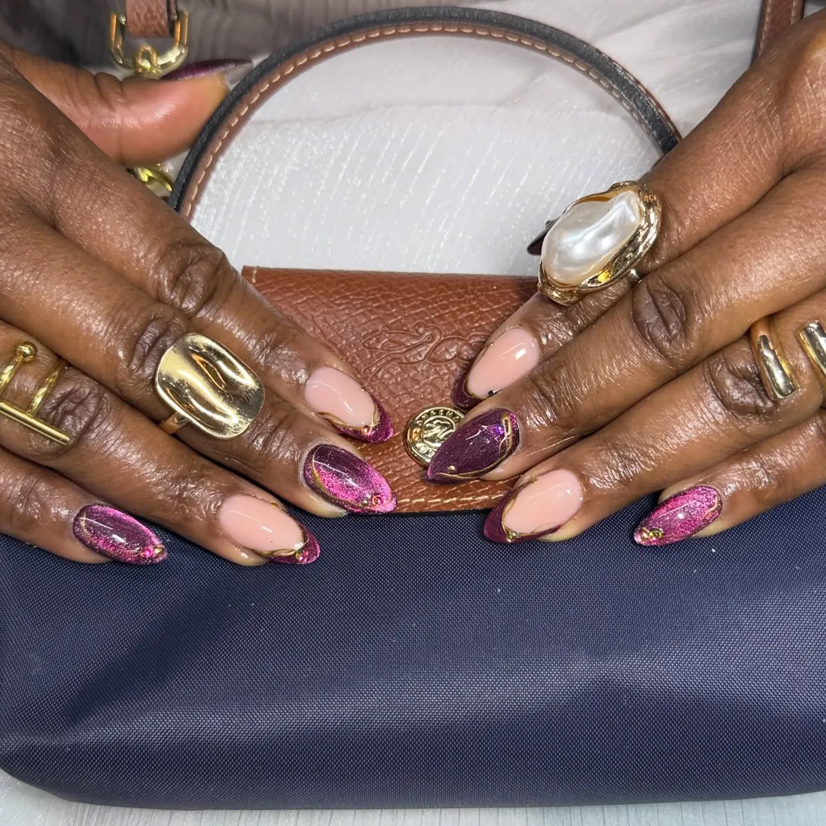 Nude and plum shimmer with gold-outlined tips