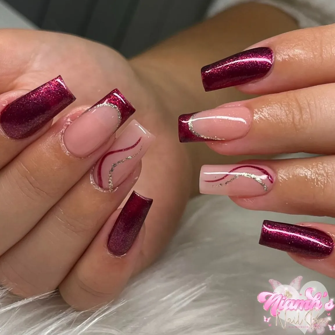 Wine glitter French tips with silver outlines and wavy accents