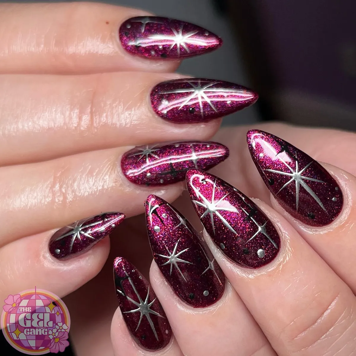 Berry-plum glitter with silver starbursts