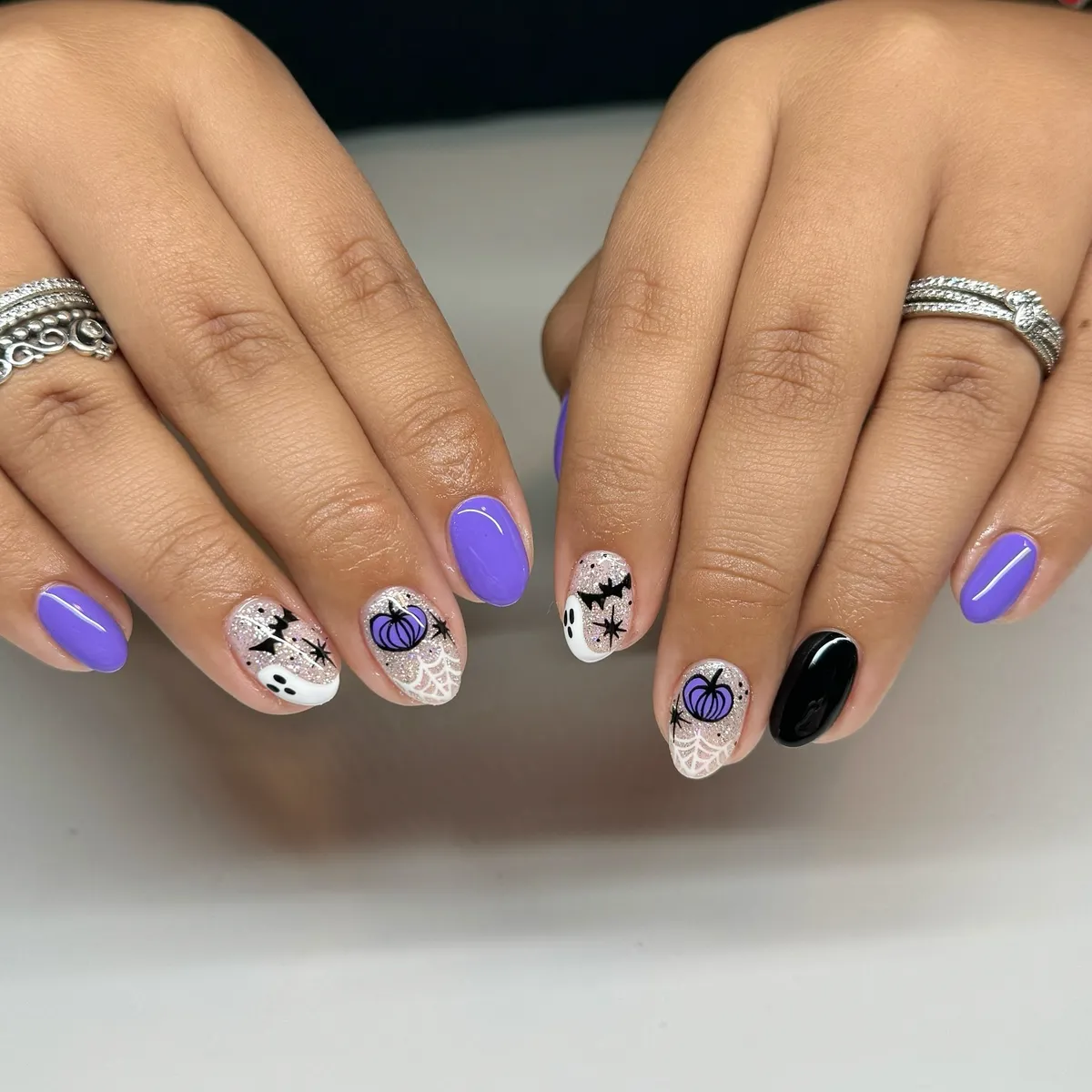 Purple pumpkins with bats and web accents