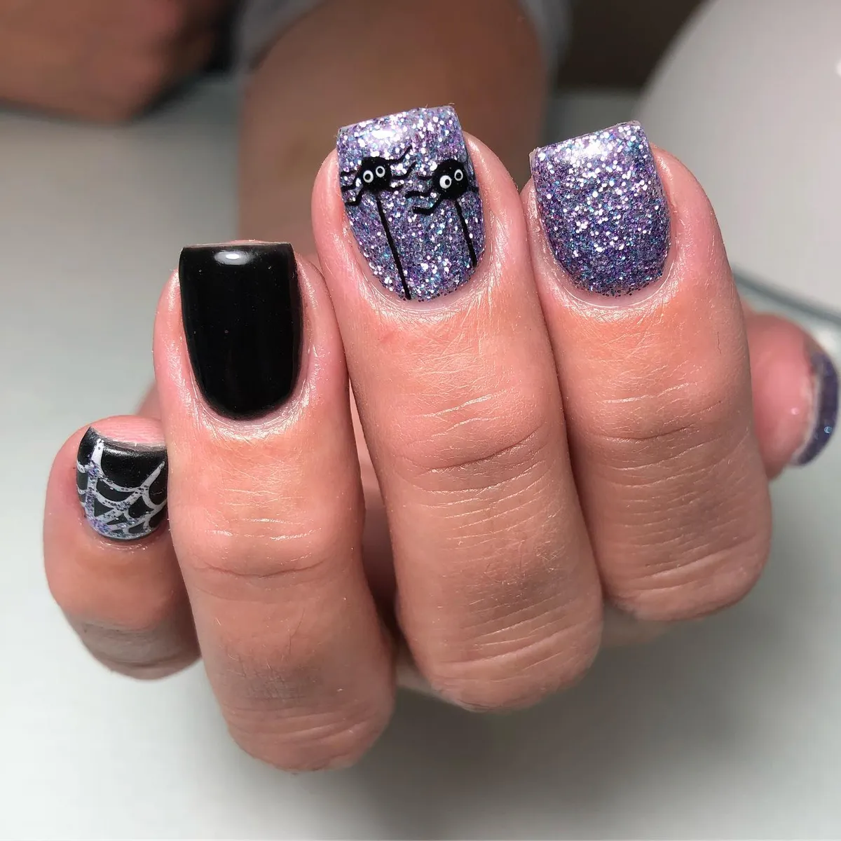 Purple glitter with dripping black-and-eyes detail
