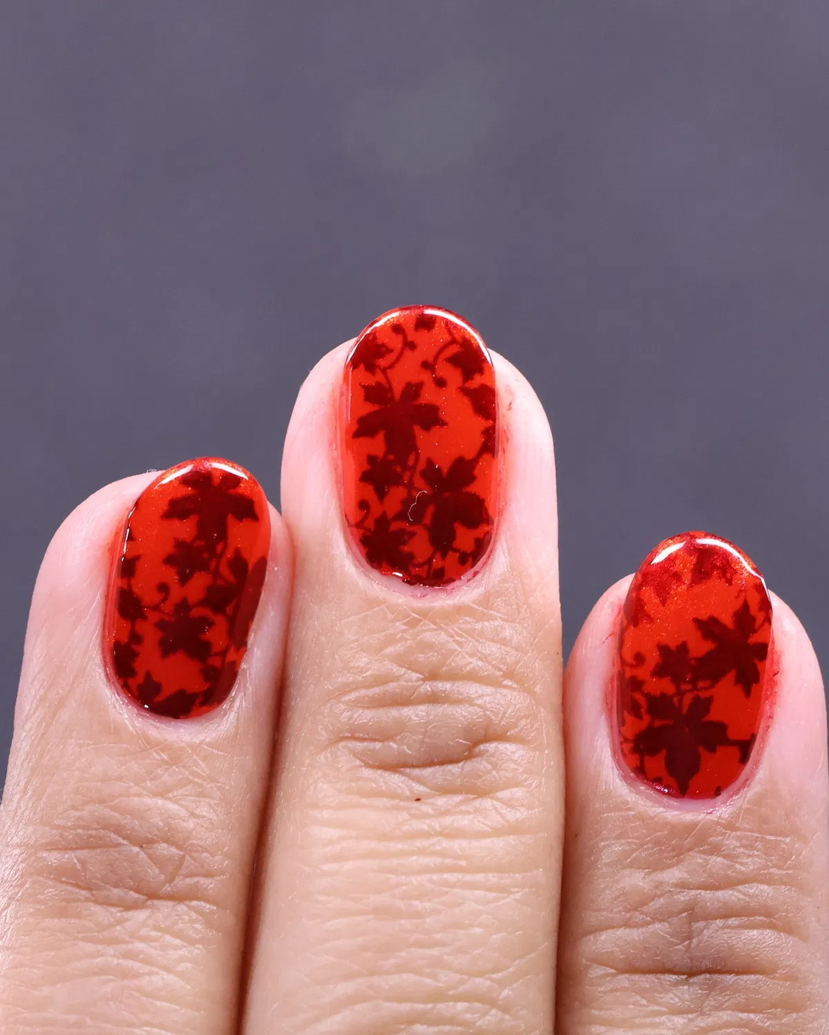 Red floral silhouette overlay