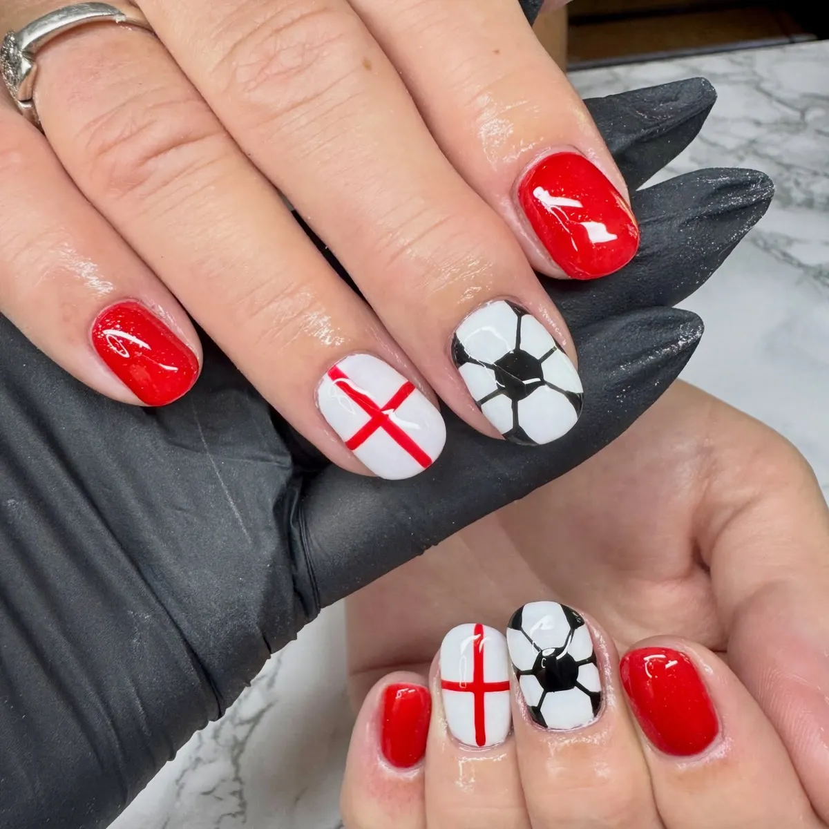 Bright red with red-cross and soccer-ball accent nails