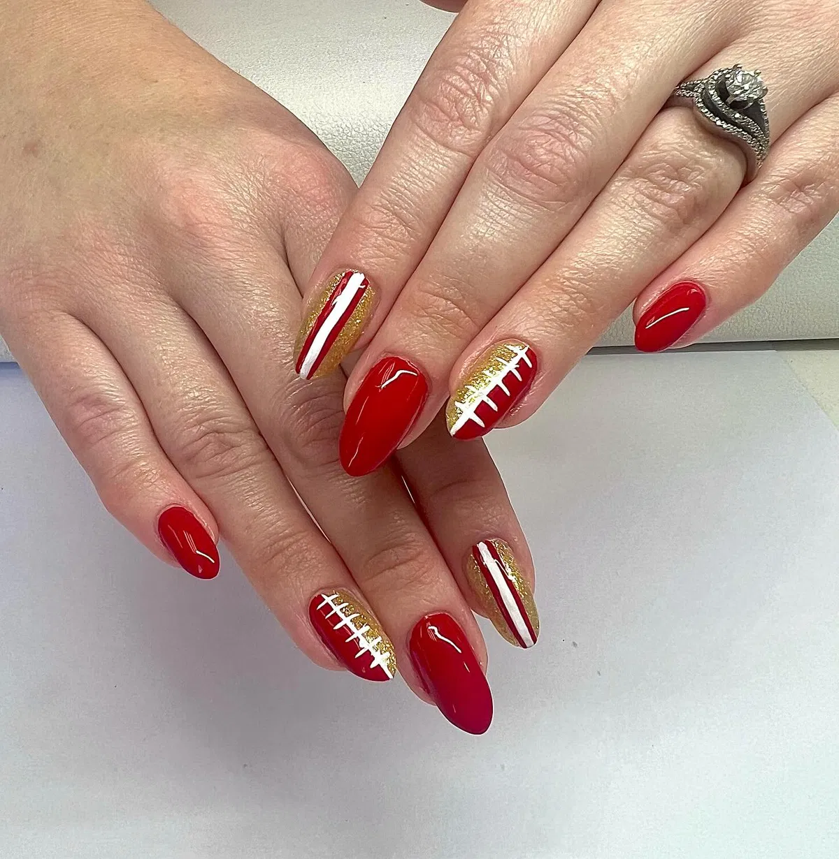 Almond red and gold glitter set with football-lace accents