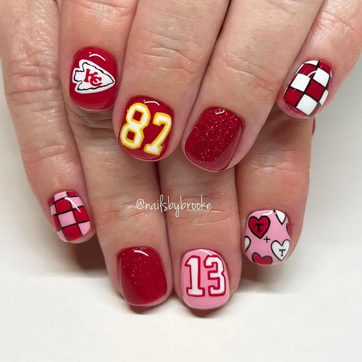 Red set with 'KC' arrowhead, jersey numbers, and checker accents