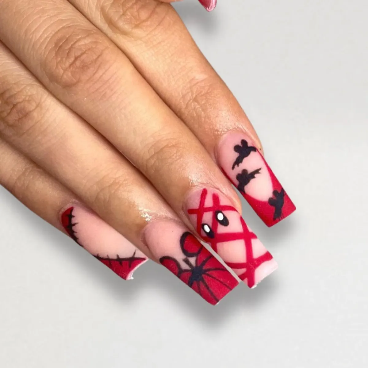 Red glitter French tips with tiny ghosts